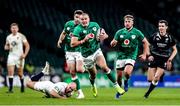 21 November 2020; Jacob Stockdale of Ireland beats the tackle of Dan Robson of England on the way to scoring his side's first try during the Autumn Nations Cup match between England and Ireland at Twickenham Stadium in London, England. Photo by Matt Impey/Sportsfile