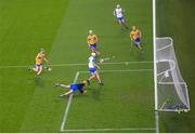 21 November 2020; Jack Fagan of Waterford shoots to score his side's third goal despite Eibhear Quilligan of Clare throwing his hurl during the GAA Hurling All-Ireland Senior Championship Quarter-Final match between Clare and Waterford at Pairc Uí Chaoimh in Cork. Photo by Harry Murphy/Sportsfile