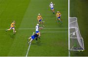 21 November 2020; Jack Fagan of Waterford shoots to score his side's third goal despite Eibhear Quilligan of Clare throwing his hurl during the GAA Hurling All-Ireland Senior Championship Quarter-Final match between Clare and Waterford at Pairc Uí Chaoimh in Cork. Photo by Harry Murphy/Sportsfile