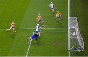 21 November 2020; Jack Fagan of Waterford shoots to score his side's third goal despite Eibhear Quilligan of Clare throwing his hurl during the GAA Hurling All-Ireland Senior Championship Quarter-Final match between Clare and Waterford at Pairc Uí Chaoimh in Cork. Photo by Harry Murphy/Sportsfile