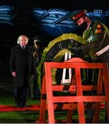 21 November 2020; Aide-De-Camp Sgt Stephen Grennan places a wreath as President Michael D Higgins looks on during the GAA Bloody Sunday Commemoration at Croke Park in Dublin. On this day 100 years ago, Sunday 21 November 1920, an attack by Crown Forces on the attendees at a challenge Gaelic Football match between Dublin and Tipperary during the Irish War of Independence resulted in 14 people being murdered. Along with the 13 supporters that lost their lives that day a Tipperary footballer, Michael Hogan, also died. The main stand in Croke Park, the Hogan Stand, was subsequently named after him. Photo by Stephen McCarthy/Sportsfile