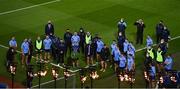 21 November 2020; The Dublin team, led by capain Stephen Cluxton, prepare to place a wreath in front of the 14 torches lit in memory of the 14 people who lost their lives on Bloody Sunday, after the Leinster GAA Football Senior Championship Final match between Dublin and Meath at Croke Park in Dublin. Photo by Brendan Moran/Sportsfile