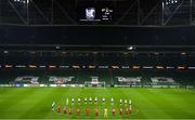 26 November 2020; Players from both teams observe a minutes silence for the late Diego Armando Maradona prior to the UEFA Europa League Group B match between Dundalk and SK Rapid Wien at Aviva Stadium in Dublin. Photo by Eóin Noonan/Sportsfile