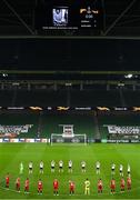 26 November 2020; Players from both teams observe a minutes silence for the late Diego Armando Maradona prior to the UEFA Europa League Group B match between Dundalk and SK Rapid Wien at Aviva Stadium in Dublin. Photo by Eóin Noonan/Sportsfile