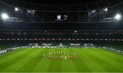 26 November 2020; Players from both teams observe a minutes silence for the late Diego Armando Maradona prior to the UEFA Europa League Group B match between Dundalk and SK Rapid Wien at Aviva Stadium in Dublin. Photo by Eóin Noonan/Sportsfile