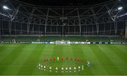 26 November 2020; Players from both sides stand for a minute's silence in memory of the late Diego Maradona prior to the start of the UEFA Europa League Group B match between Dundalk and SK Rapid Wien at Aviva Stadium in Dublin. Photo by Stephen McCarthy/Sportsfile