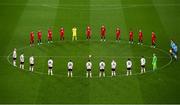 26 November 2020; Players from both sides stand for a minute's silence in memory of the late Diego Maradona prior to the start of the UEFA Europa League Group B match between Dundalk and SK Rapid Wien at Aviva Stadium in Dublin. Photo by Stephen McCarthy/Sportsfile