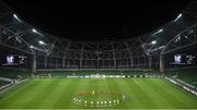 26 November 2020; Players from both sides stand for a minute's silence in memory of the late Diego Maradona prior to the start of the UEFA Europa League Group B match between Dundalk and SK Rapid Wien at Aviva Stadium in Dublin. Photo by Stephen McCarthy/Sportsfile