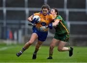 28 November 2020; Niamh O'Dea of Clare is tackled by Emma Troy of Meath during the TG4 All-Ireland Intermediate Ladies Football Championship Semi-Final match between Clare and Meath at MW Hire O'Moore Park in Portlaoise, Laois. Photo by Brendan Moran/Sportsfile