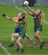 28 November 2020; Monica McGuirk of Meath saves under pressure from team-mate Emma Troy and Niamh O'Dea of Clare during the TG4 All-Ireland Intermediate Ladies Football Championship Semi-Final match between Clare and Meath at MW Hire O'Moore Park in Portlaoise, Laois. Photo by Brendan Moran/Sportsfile