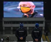 28 November 2020; Waterford manager Liam Cahill, left, and selector Michael Bevans during the National Anthem, as Kilkenny manager Brian Cody appears on the big screen, ahead of the GAA Hurling All-Ireland Senior Championship Semi-Final match between Kilkenny and Waterford at Croke Park in Dublin. Photo by Ramsey Cardy/Sportsfile