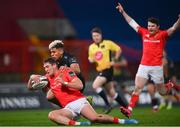 30 November 2020; Dan Goggin of Munster scores his side's first try despite the tackle of Junior Laloifi of Zebre during the Guinness PRO14 match between Munster and Zebre at Thomond Park in Limerick. Photo by Ramsey Cardy/Sportsfile