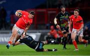 30 November 2020; Dan Goggin of Munster is tackled by Alessandro Fusco of Zebre during the Guinness PRO14 match between Munster and Zebre at Thomond Park in Limerick. Photo by Ramsey Cardy/Sportsfile