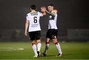 29 November 2020; Jordan Flores of Dundalk is congratulated by team-mate Patrick McEleney, right, after scoring their side's tenth goal during the Extra.ie FAI Cup Semi-Final match between Athlone Town and Dundalk at Athlone Town Stadium in Athlone, Westmeath. Photo by Stephen McCarthy/Sportsfile