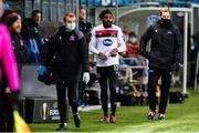 3 December 2020; Nathan Oduwa of Dundalk accompanied by physiotherapist Danny Miller leaves the pitch after picking up an injury during the UEFA Europa League Group B match between Molde FK and Dundalk at Molde Stadion in Molde, Norway. Photo by Marius Simensen/Sportsfile