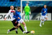 3 December 2020; Erling Knudtzon of Molde is tackled by Chris Shields of Dundalk during the UEFA Europa League Group B match between Molde FK and Dundalk at Molde Stadion in Molde, Norway. Photo by Marius Simensen/Sportsfile