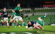 5 December 2020; Duhan van der Merwe of Scotland dives over to score his side's first try, despite the efforts of Ireland's Keith Earls, during the Autumn Nations Cup match between Ireland and Scotland at the Aviva Stadium in Dublin. Photo by Seb Daly/Sportsfile