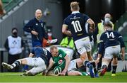 5 December 2020; Keith Earls of Ireland scores his side's first try, despite the efforts of Scotland's Ali Price, during the Autumn Nations Cup match between Ireland and Scotland at the Aviva Stadium in Dublin. Photo by Seb Daly/Sportsfile