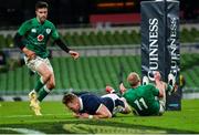 5 December 2020; Duhan van der Merwe of Scotland dives over to score his side's first try, despite the efforts of Ireland's Keith Earls, during the Autumn Nations Cup match between Ireland and Scotland at the Aviva Stadium in Dublin. Photo by Seb Daly/Sportsfile
