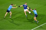 5 December 2020; Martin Reilly of Cavan kicks the first point of the game despite the challenge of Robert McDaid, left, and Jonny Cooper of Dublin during the GAA Football All-Ireland Senior Championship Semi-Final match between Cavan and Dublin at Croke Park in Dublin. Photo by Dáire Brennan/Sportsfile