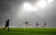 6 December 2020; Linesman Brendan Cawley keeps a close eye as Patrick Durcan of Mayo kicks the ball forwards, as fog descends, during the GAA Football All-Ireland Senior Championship Semi-Final match between Mayo and Tipperary at Croke Park in Dublin. Photo by Ray McManus/Sportsfile