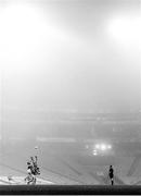 6 December 2020; (EDITOR'S NOTE; Image has been converted to Black and White) Diarmuid O'Connor of Mayo beats team-mate Aidan O'Shea and Colin O'Riordan of Tipperary to catch the throw in for the start of the second half amid heavy fog during the GAA Football All-Ireland Senior Championship Semi-Final match between Mayo and Tipperary at Croke Park in Dublin. Photo by Brendan Moran/Sportsfile