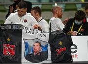 6 December 2020; Brian Gartland of Dundalk hangs a flag in memory of Harry Taaffe following the Extra.ie FAI Cup Final match between Shamrock Rovers and Dundalk at the Aviva Stadium in Dublin. Photo by Eóin Noonan/Sportsfile