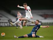10 December 2020; Shkodran Mustafi of Arsenal in action against Daniel Kelly of Dundalk during the UEFA Europa League Group B match between Dundalk and Arsenal at the Aviva Stadium in Dublin. Photo by Stephen McCarthy/Sportsfile