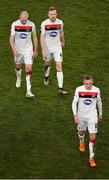 10 December 2020; Dundalk players, from left, Chris Shields, Sean Hoare and John Mountney leave the field following their side's defeat during the UEFA Europa League Group B match between Dundalk and Arsenal at the Aviva Stadium in Dublin. Photo by Seb Daly/Sportsfile