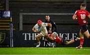 11 December 2020; Cheslin Kolbe of Toulouse on his way to score his side's fourth try despite the tackle of Michael Lowry of Ulster during the Heineken Champions Cup Pool B Round 1 match between Ulster and Toulouse at Kingspan Stadium in Belfast. Photo by Ramsey Cardy/Sportsfile
