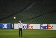 10 December 2020; Brian Gartland of Dundalk tests the bounce of a match ball as heavy rain falls ahead of the UEFA Europa League Group B match between Dundalk and Arsenal at the Aviva Stadium in Dublin. Photo by Ben McShane/Sportsfile