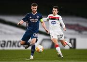 10 December 2020; Shkodran Mustafi of Arsenal and Jamie Wynne of Dundalk during the UEFA Europa League Group B match between Dundalk and Arsenal at the Aviva Stadium in Dublin. Photo by Ben McShane/Sportsfile