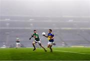 6 December 2020; Bill Maher of Tipperary races past Kevin McLoughlin of Mayo during the GAA Football All-Ireland Senior Championship Semi-Final match between Mayo and Tipperary at Croke Park in Dublin. Photo by Ray McManus/Sportsfile
