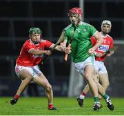 12 December 2020; Josh Considine of Limerick in action against Eoin Carey of Cork during the Bord Gáis Energy Munster GAA Hurling U20 Championship Semi-Final match between Limerick and Cork at LIT Gaelic Grounds in Limerick. Photo by Matt Browne/Sportsfile