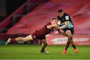 13 December 2020; Nathan Earle of Harlequins evades the tackle of Munster's Chris Farrell during the Heineken Champions Cup Pool B Round 1 match between Munster and Harlequins at Thomond Park in Limerick. Photo by Seb Daly/Sportsfile