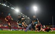 13 December 2020; Cadan Murley of Harlequins evades the tackle of Munster's Andrew Conway, right, and Peter O’Mahony on his way to scoring his side's first try during the Heineken Champions Cup Pool B Round 1 match between Munster and Harlequins at Thomond Park in Limerick. Photo by Seb Daly/Sportsfile