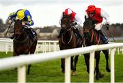 14 December 2020; Free Thought, right, with Danny Mullins up, races alongside eventual second and third places Pictures Of Home, left, with Jack Kennedy up, and Ensel Du Perche, with Jonathan Moore up, on their way to winning the Support Local This Christmas Maiden Hurdle at Naas Racecourse in Kildare. Photo by Seb Daly/Sportsfile