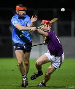 18 December 2020; Ian O Heithir of Dublin in action against Ross Banville of Wexford during the Bord Gais Energy Leinster Under 20 Hurling Championship Semi-Final match between Wexford and Dublin at Netwatch Cullen Park in Carlow. Photo by Matt Browne/Sportsfile