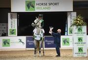 18 December 2020; Shane Breen on Compelling Z is presented with the trophy by Horse Sport Ireland acting CEO Joe Reynolds after winning the Horse Sport Ireland Show Jumping Masters at Emerald International Equestrian Centre in Enfield, Kildare. Photo by Stephen McCarthy/Sportsfile