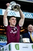 19 December 2020; Galway captain Jack Glynn accepts the cup from Uachtarán Chumann Lúthchleas Gael John Horan following victory in the EirGrid GAA Football All-Ireland Under 20 Championship Final match between Dublin and Galway at Croke Park in Dublin. Photo by Ray McManus/Sportsfile