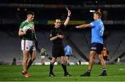 19 December 2020; Referee David Coldrick issues a yellow card to Jonny Cooper of Dublin during the GAA Football All-Ireland Senior Championship Final match between Dublin and Mayo at Croke Park in Dublin. Photo by Sam Barnes/Sportsfile