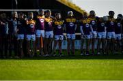20 December 2020; Wexford players, from left, JJ Twamley, 12, Liam Schockman, 5, Shamey O’Hagan, 14, and Cian Byrne, 11, during the national anthem prior to the Electric Ireland Leinster GAA Hurling Minor Championship Semi-Final match between Wexford and Kilkenny at Chadwicks Wexford Park in Wexford. Photo by Seb Daly/Sportsfile