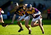 20 December 2020; Harry Shine of Kilkenny in action against Cian O’Tuama of Wexford during the Electric Ireland Leinster GAA Hurling Minor Championship Semi-Final match between Wexford and Kilkenny at Chadwicks Wexford Park in Wexford. Photo by Seb Daly/Sportsfile