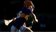 20 December 2020; Sean Kenneally of Tipperary in action against Ethan Hurley of Limerick during the Electric Ireland Munster GAA Hurling Minor Championship Final match between Limerick and Tipperary at LIT Gaelic Grounds in Limerick. Photo by David Fitzgerald/Sportsfile