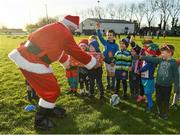 20 December 2020; Santa Claus hands out a present during Gorey RFC Minis Training at Gorey RFC in Gorey, Wexford. Photo by Seb Daly/Sportsfile
