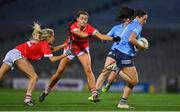 20 December 2020; Sinéad Goldrick of Dublin breaks through the tackles of Orla Finn and Eimear Meaney of Cork during the TG4 All-Ireland Senior Ladies Football Championship Final match between Cork and Dublin at Croke Park in Dublin. Photo by Brendan Moran/Sportsfile