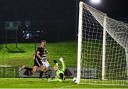 21 December 2020; Evan Ferguson of Bohemians scores his side's second goal despite the efforts of Killian Cahill of Shamrock Rovers during the SSE Airtricity U17 National League Final match between Shamrock Rovers and Bohemians at the UCD Bowl in Dublin. Photo by Sam Barnes/Sportsfile