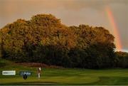 24 September 2020; Aaron Rai of England lines up a putt on the 18th green under a rainbow during day one of the Dubai Duty Free Irish Open Golf Championship at Galgorm Spa & Golf Resort in Ballymena, Antrim. Due to ongoing restrictions imposed by the Irish and British Governments to contain the spread of the Coronavirus (Covid-19) pandemic, elite sport is still permitted to take place behind closed doors. Photo by Brendan Moran/Sportsfile