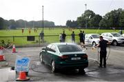 15 August 2020; Dean Adams from Scrub A Dub car wash washing a car during the Dublin County Senior 1 Football Championship Group 2 Round 3 match between Na Fianna and Ballinteer St Johns at Balgriffin in Dublin. Photo by David Fitzgerald/Sportsfile