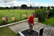 18 July 2020; A general view of action as Andrew Roy from Tipperary hits his tee shot from the 2nd on the pitch and putt course during the Dublin County Senior Hurling Championship Group 2 Round 1 match between Craobh Chiarain and Scoil Ui Chonaill GAA at O'Toole Park in Dublin. Competitive GAA matches have been approved to return following the guidelines of Phase 3 of the Irish Government’s Roadmap for Reopening of Society and Business and protocols set down by the GAA governing authorities. With games having been suspended since March, competitive games can take place with updated protocols including a limit of 200 individuals at any one outdoor event, including players, officials and a limited number of spectators, with social distancing, hand sanitisation and face masks being worn by those in attendance among other measures in an effort to contain the spread of the Coronavirus (COVID-19) pandemic. Photo by David Fitzgerald/Sportsfile